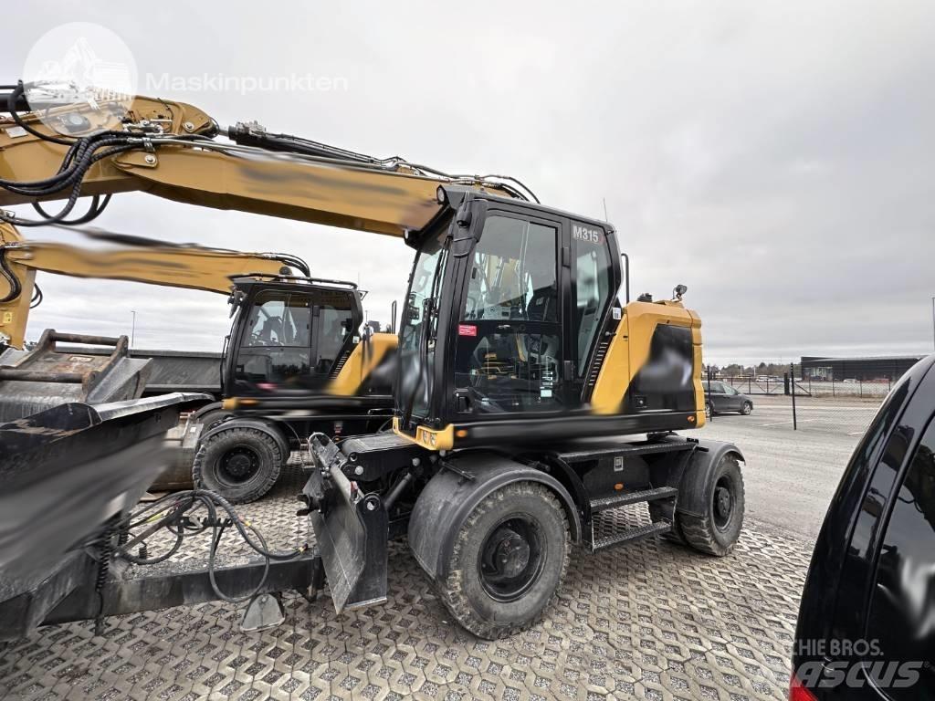 CAT M 315 Pelle sur pneus