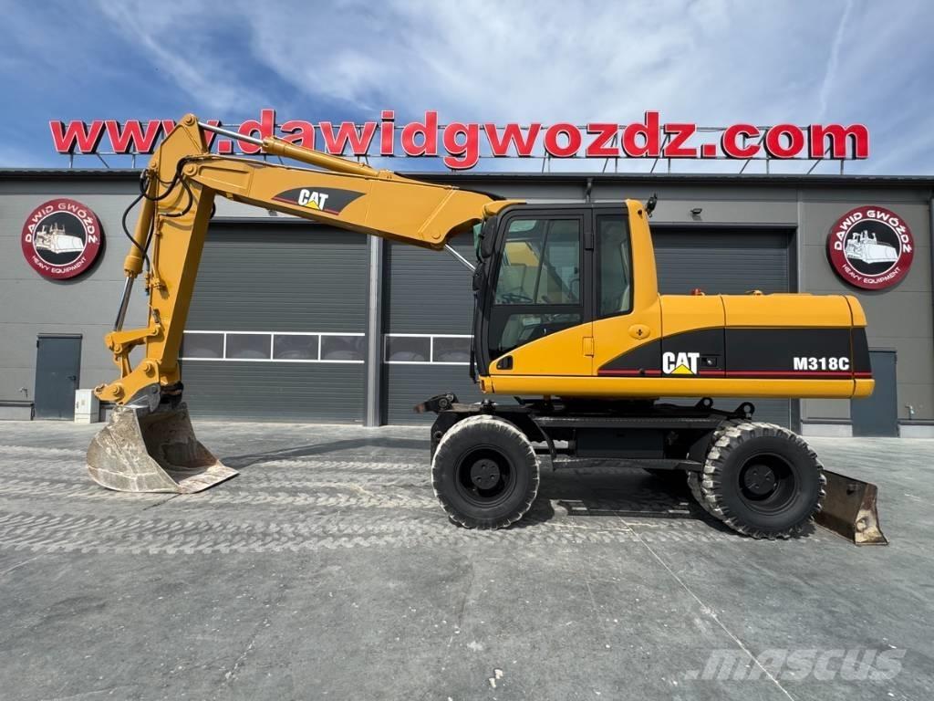 CAT M 318 C Pelle sur pneus