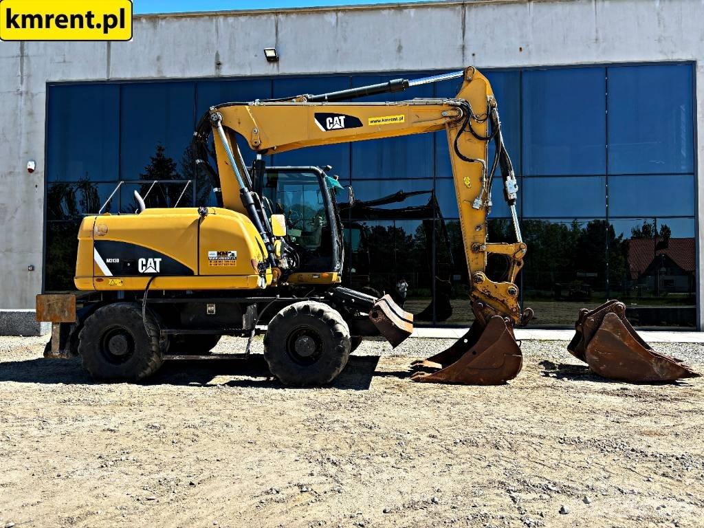 CAT M 313 D Pelle sur pneus
