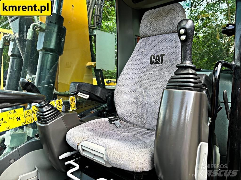 CAT M 313 D Pelle sur pneus