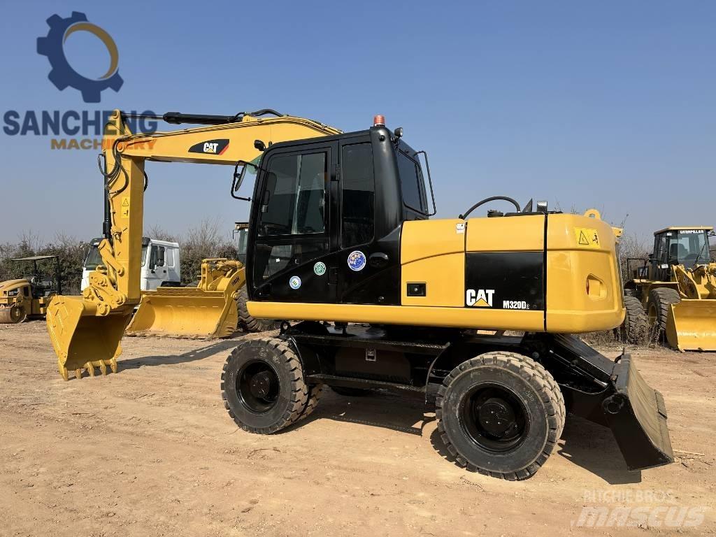 CAT M320D Pelle sur pneus