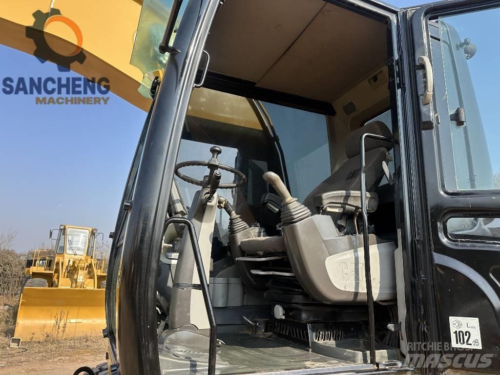 CAT M320D Pelle sur pneus