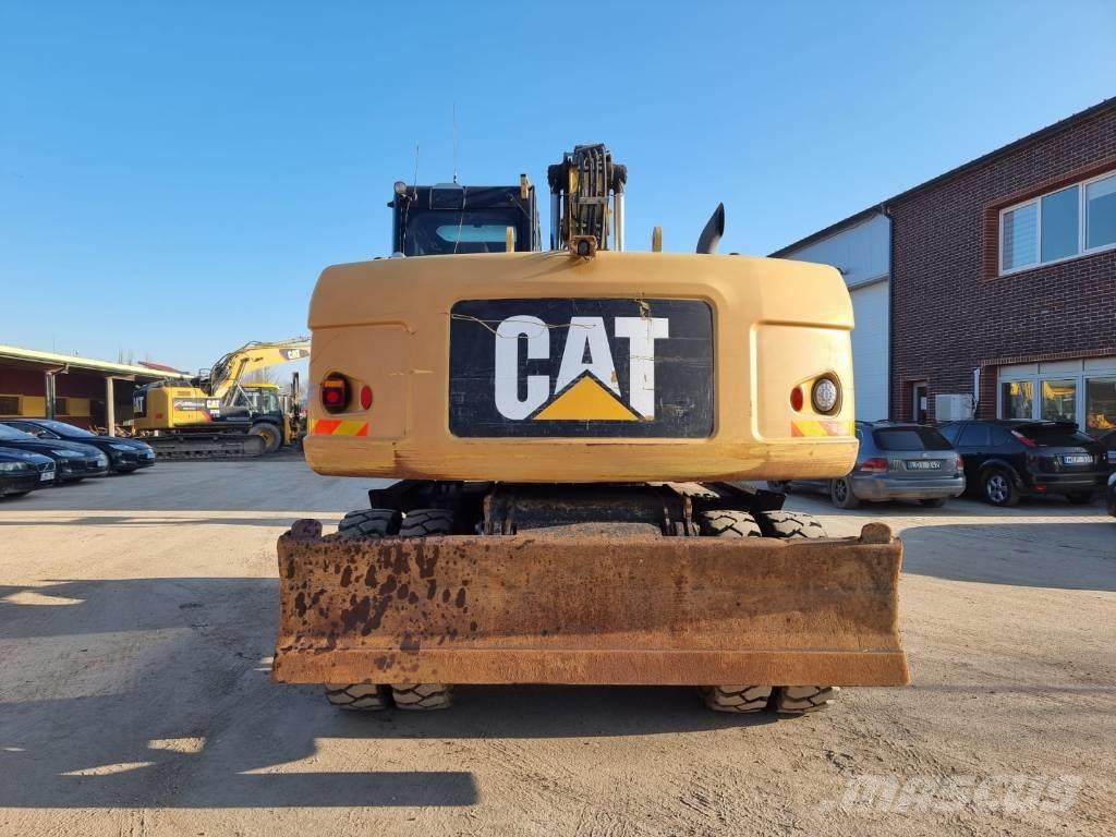 CAT M 316 D II Pelle sur pneus