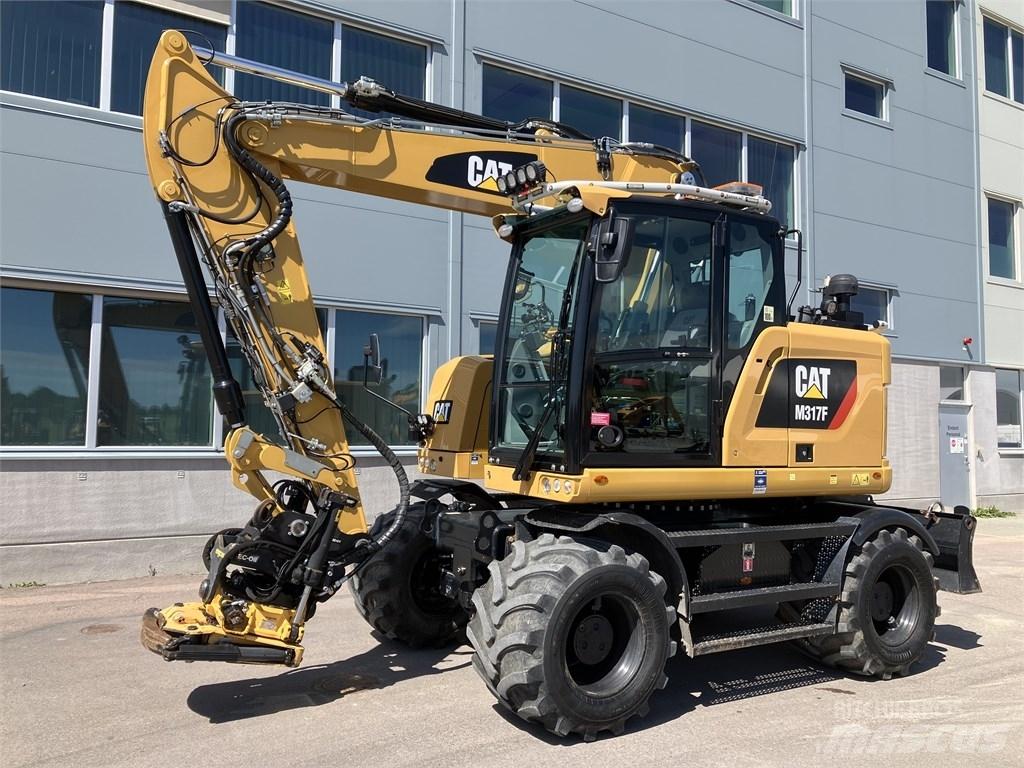 CAT 317 F Pelle sur pneus