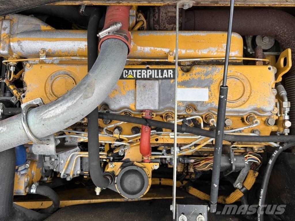 CAT M 318 C Pelle sur pneus