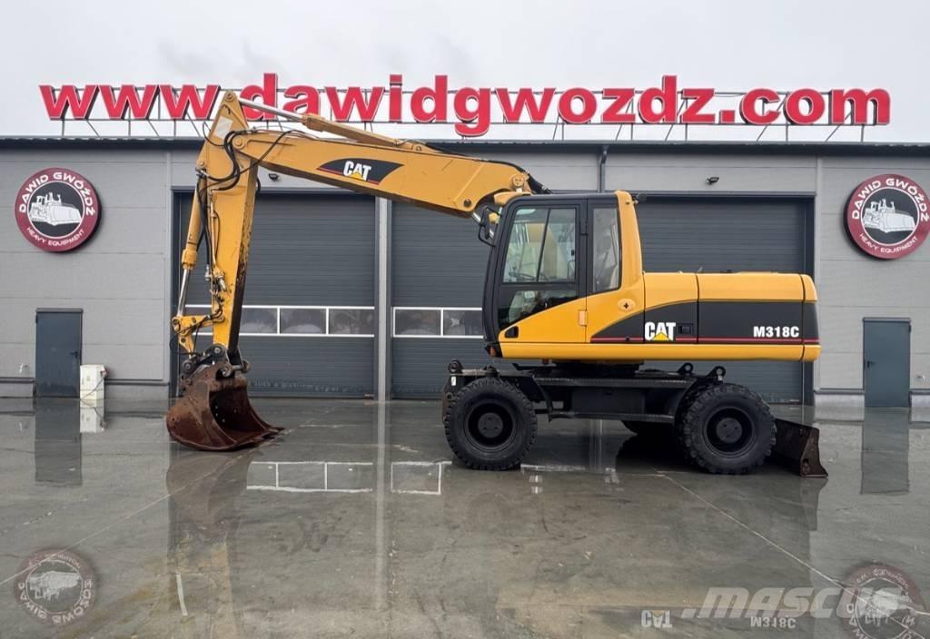 CAT M 318 C Pelle sur pneus