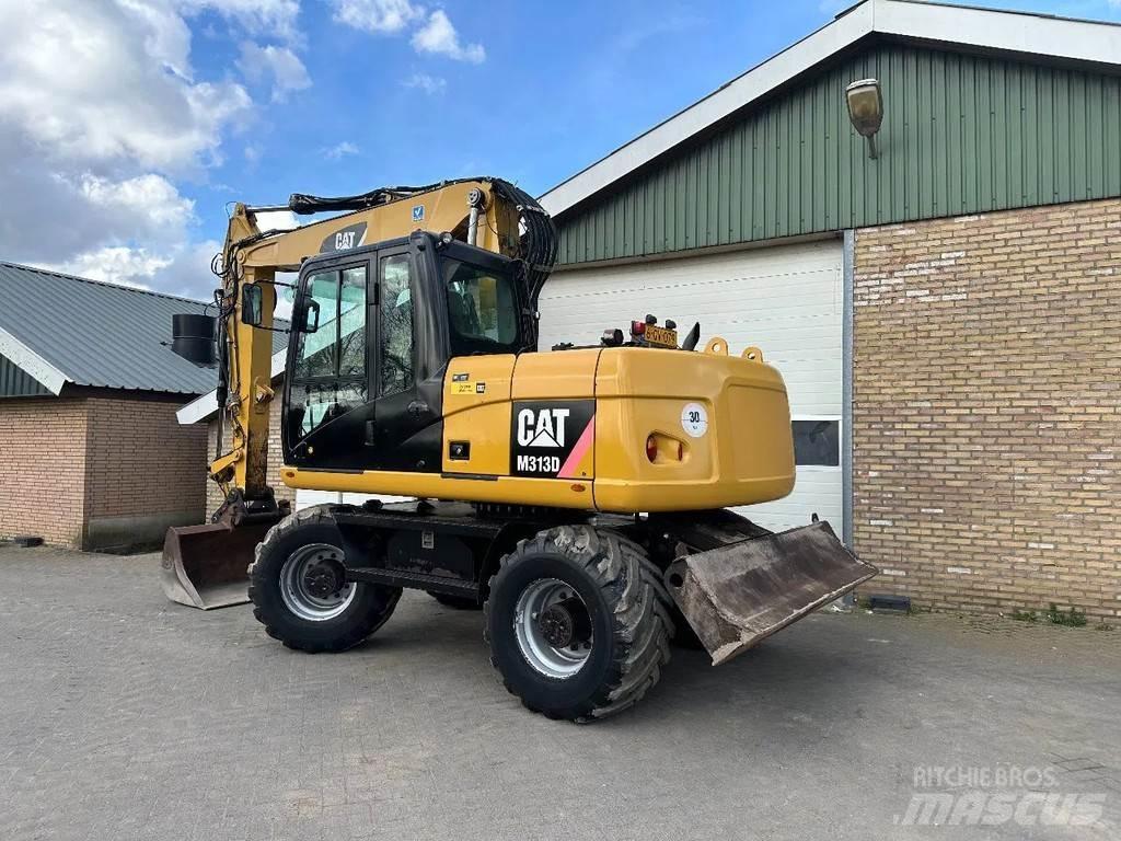 CAT M313D Pelle sur pneus
