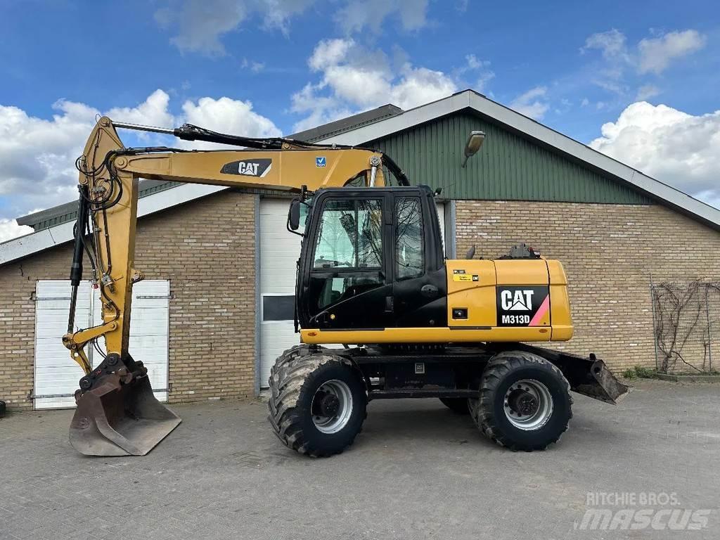 CAT M313D Pelle sur pneus