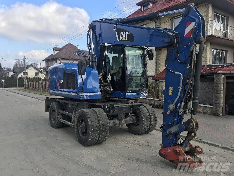 CAT M318f 318 f Pelle sur pneus