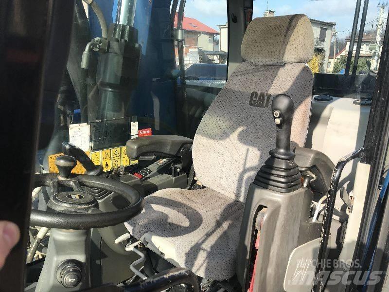 CAT M318f 318 f Pelle sur pneus