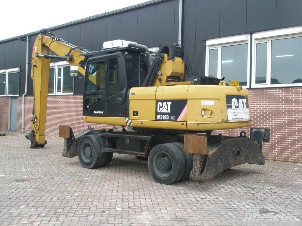 CAT M318D Pelle sur pneus