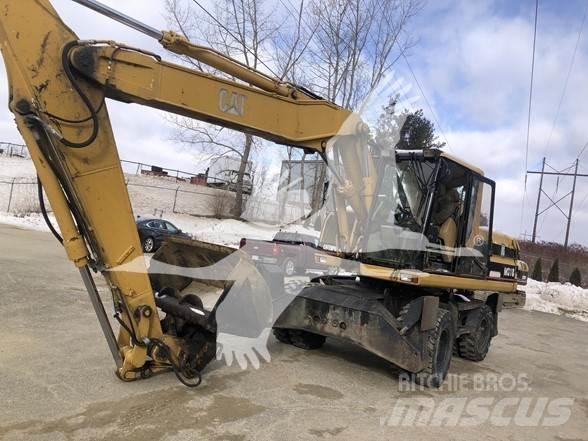 CAT M318 Pelle sur pneus