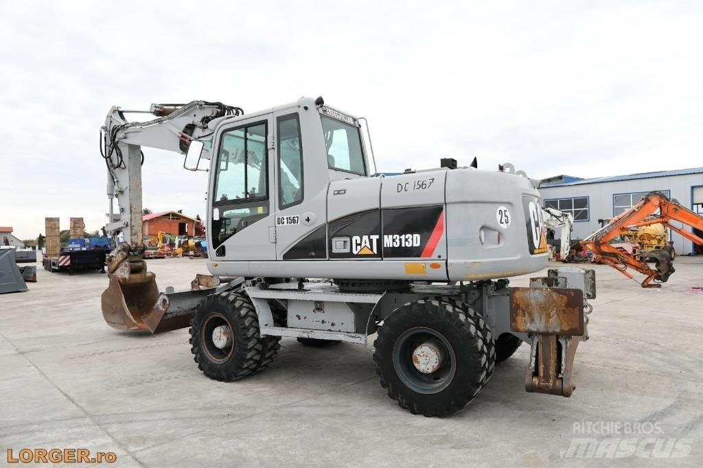 CAT M 313 D Pelle sur pneus