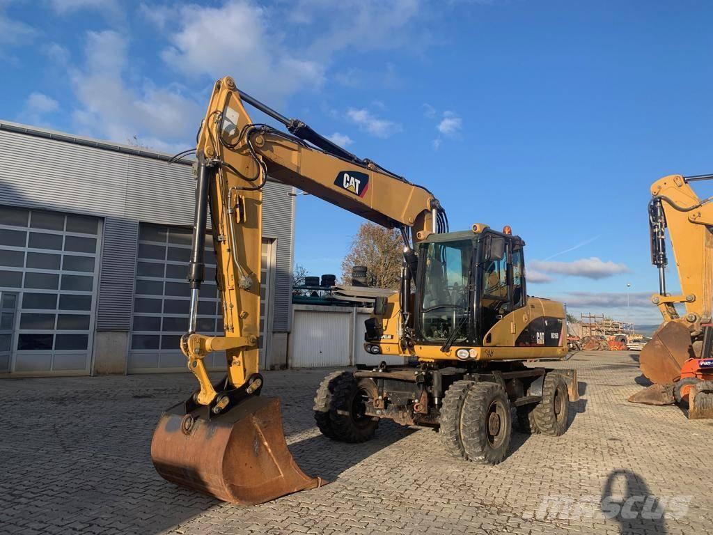 CAT M 316 D Pelle sur pneus