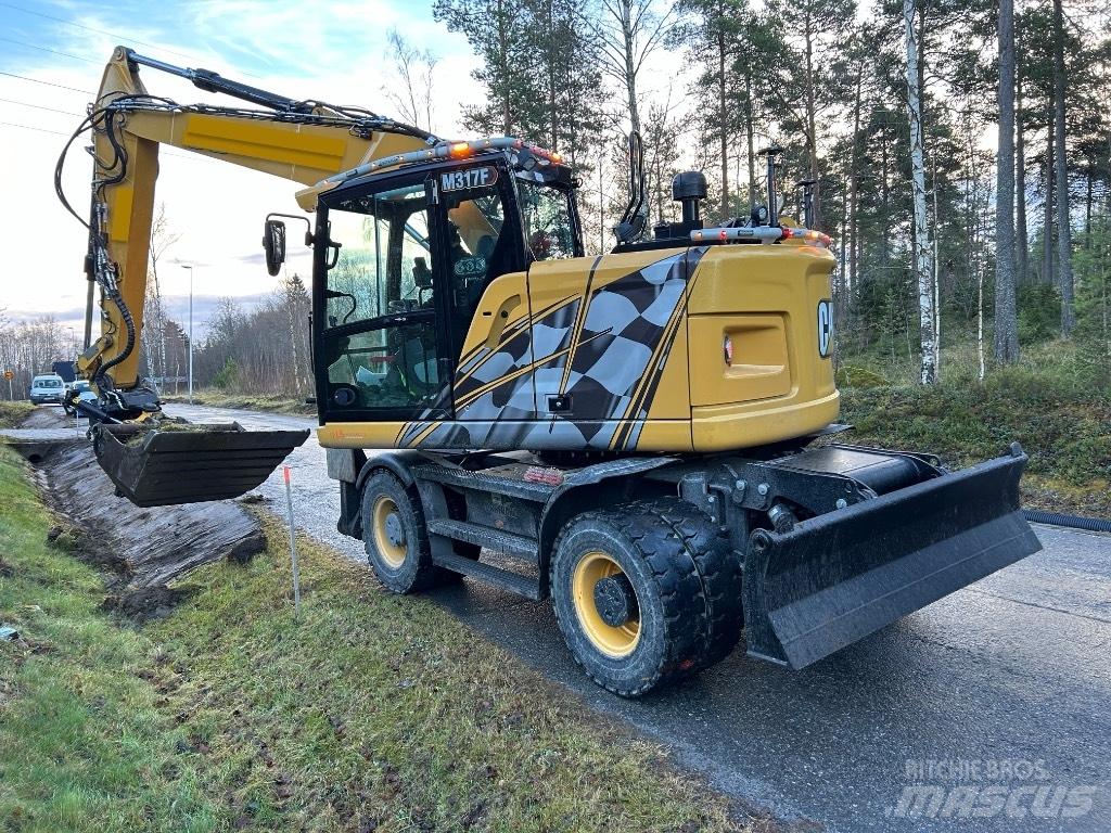 CAT M 317F Pelle sur pneus