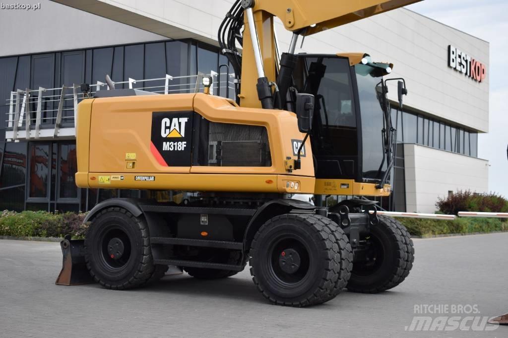 CAT M 318 F Pelle sur pneus