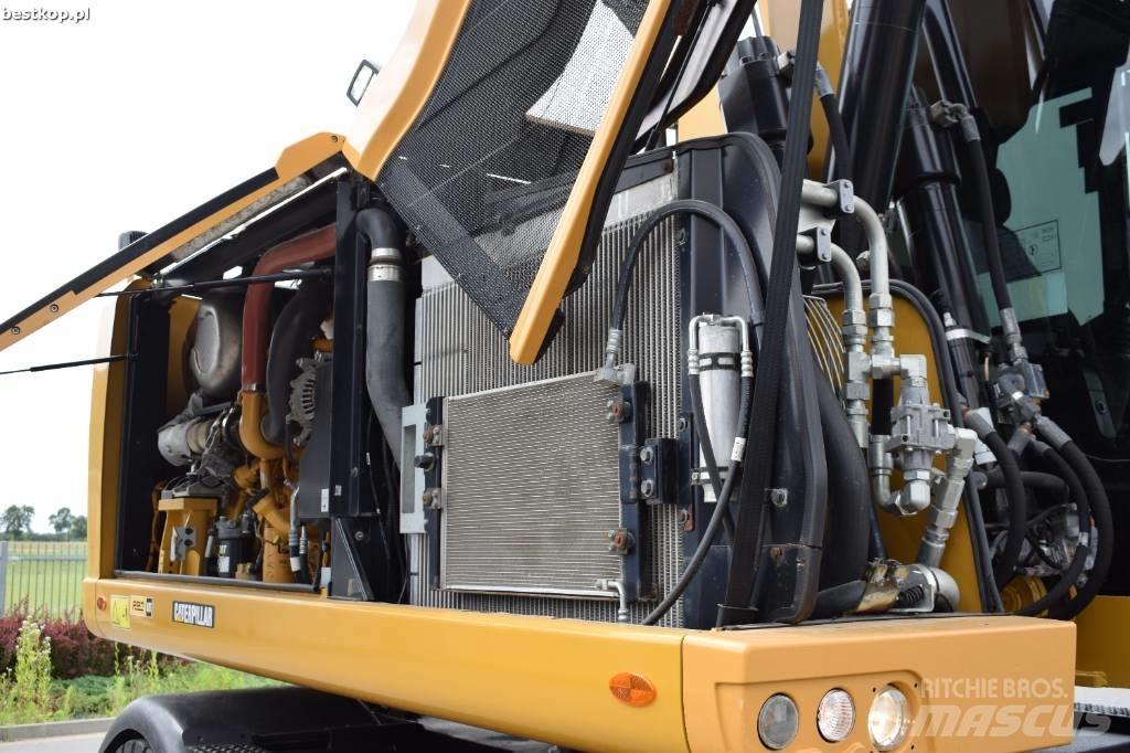 CAT M 318 F Pelle sur pneus