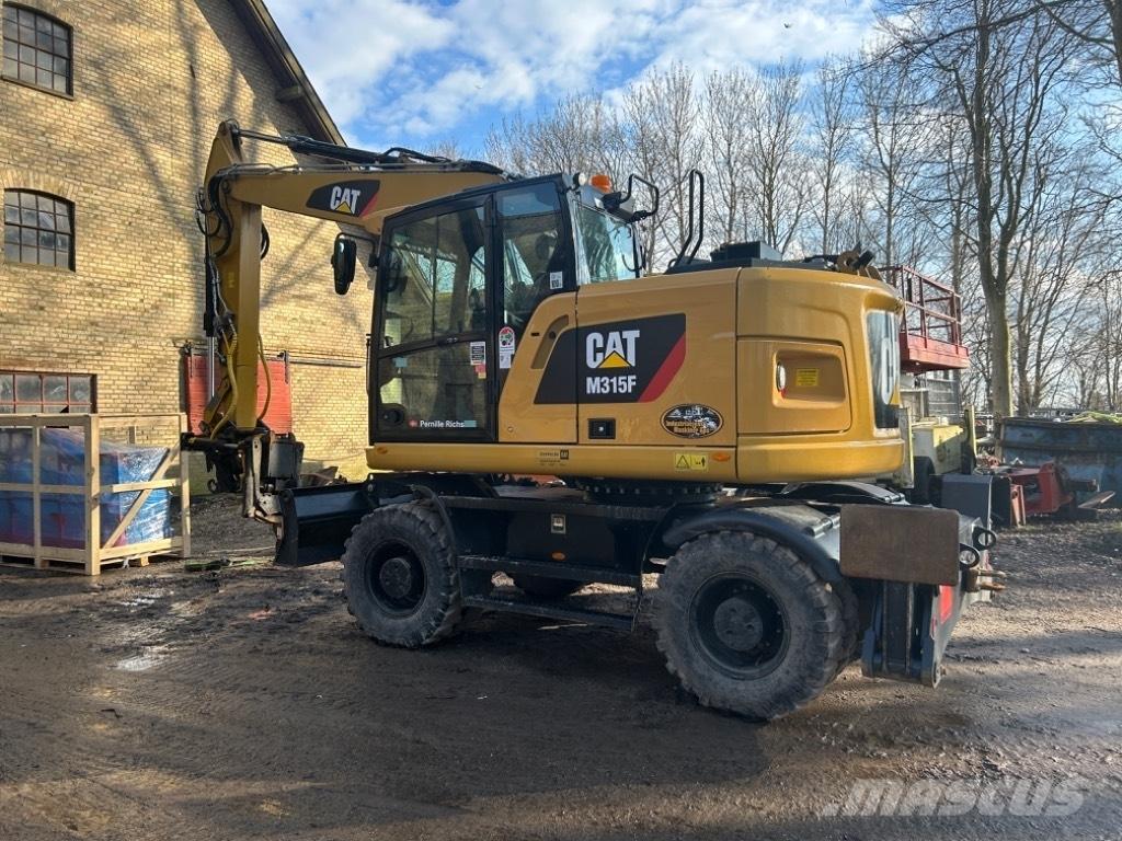 CAT M315F Pelle sur pneus