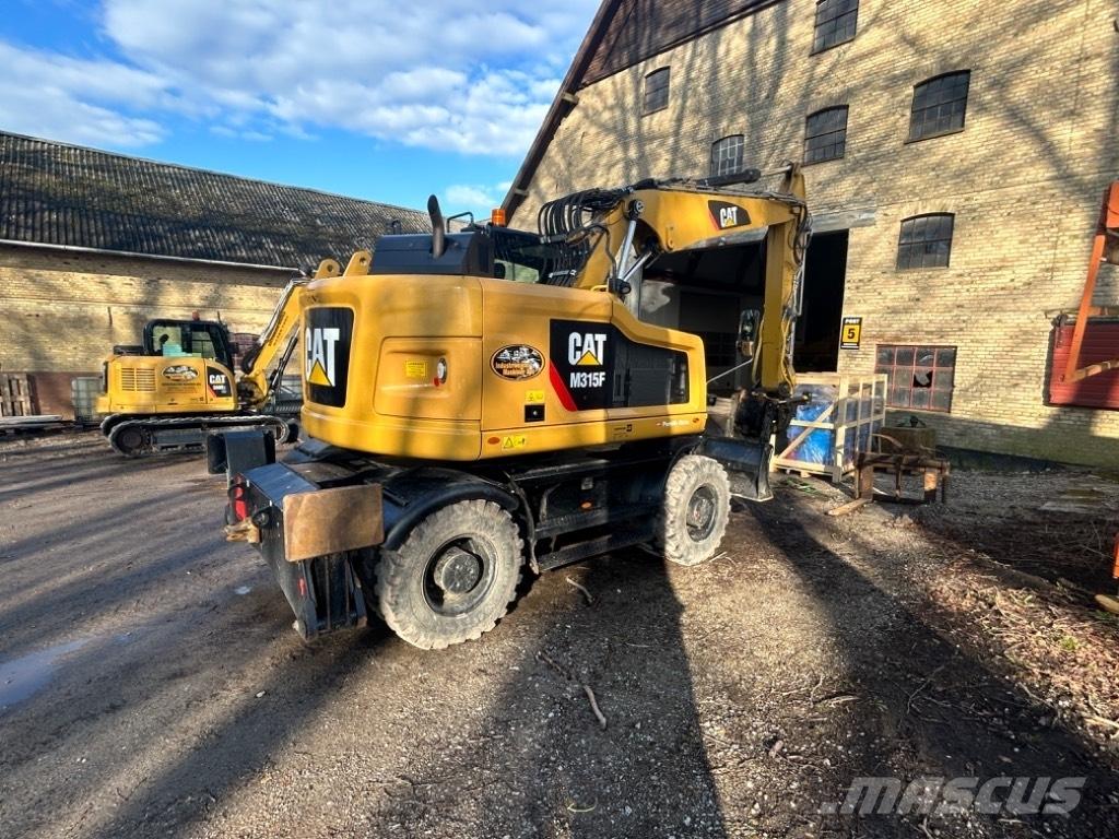 CAT M315F Pelle sur pneus