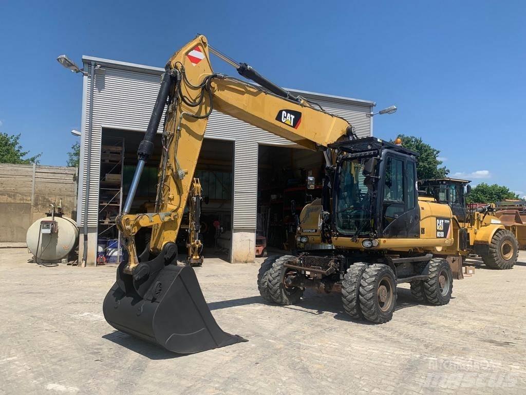 CAT M 318 D Pelle sur pneus