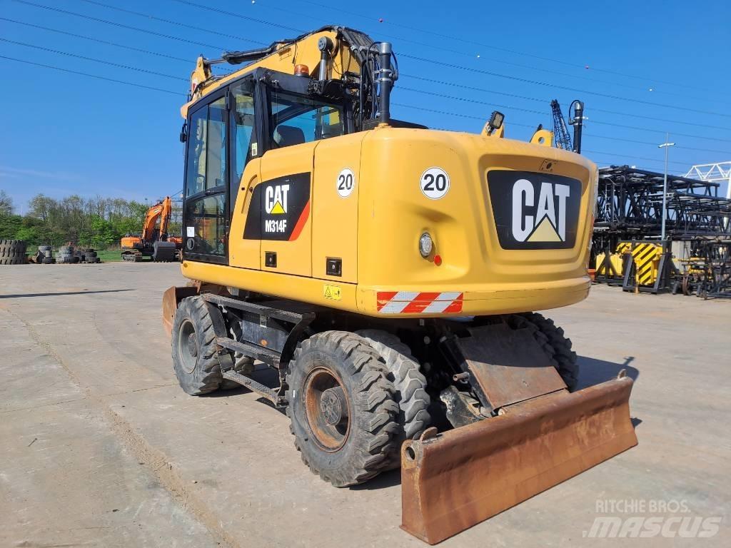 CAT M314F Pelle sur pneus