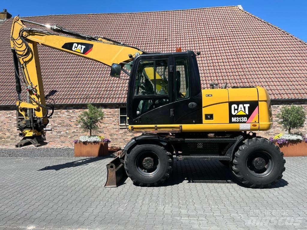 CAT M 313 D Pelle sur pneus