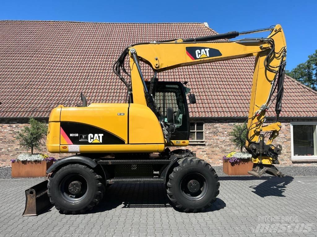 CAT M 313 D Pelle sur pneus