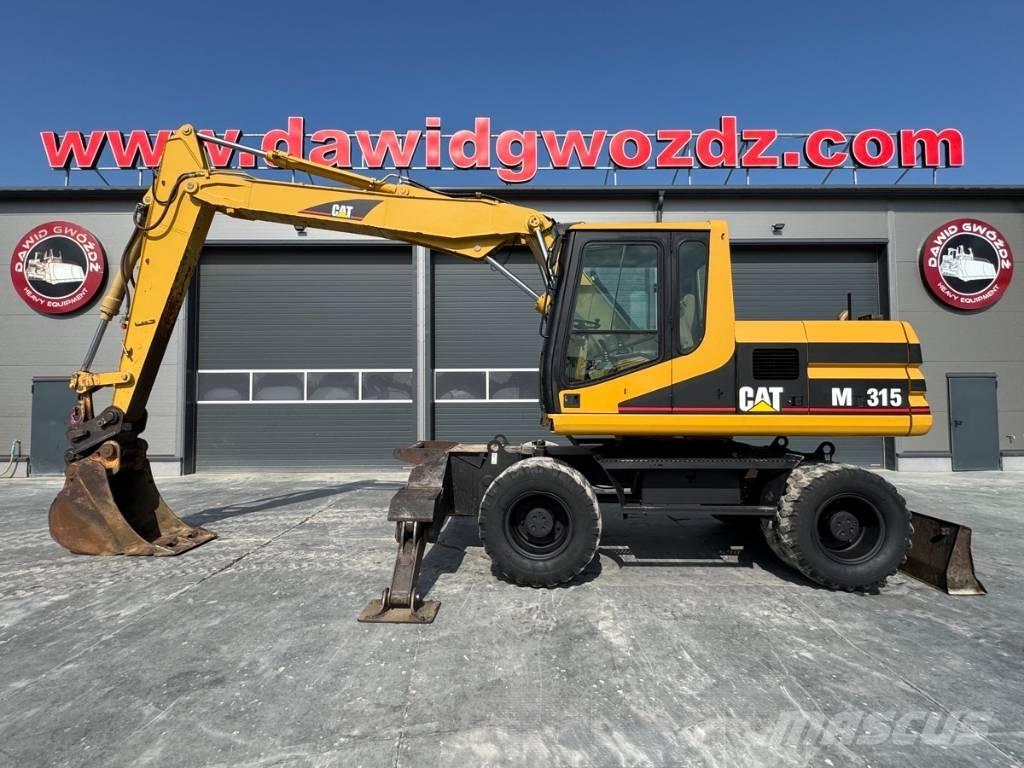 CAT M 315 Pelle sur pneus