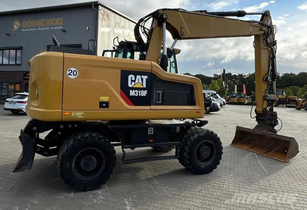 CAT M 318 F Pelle sur pneus