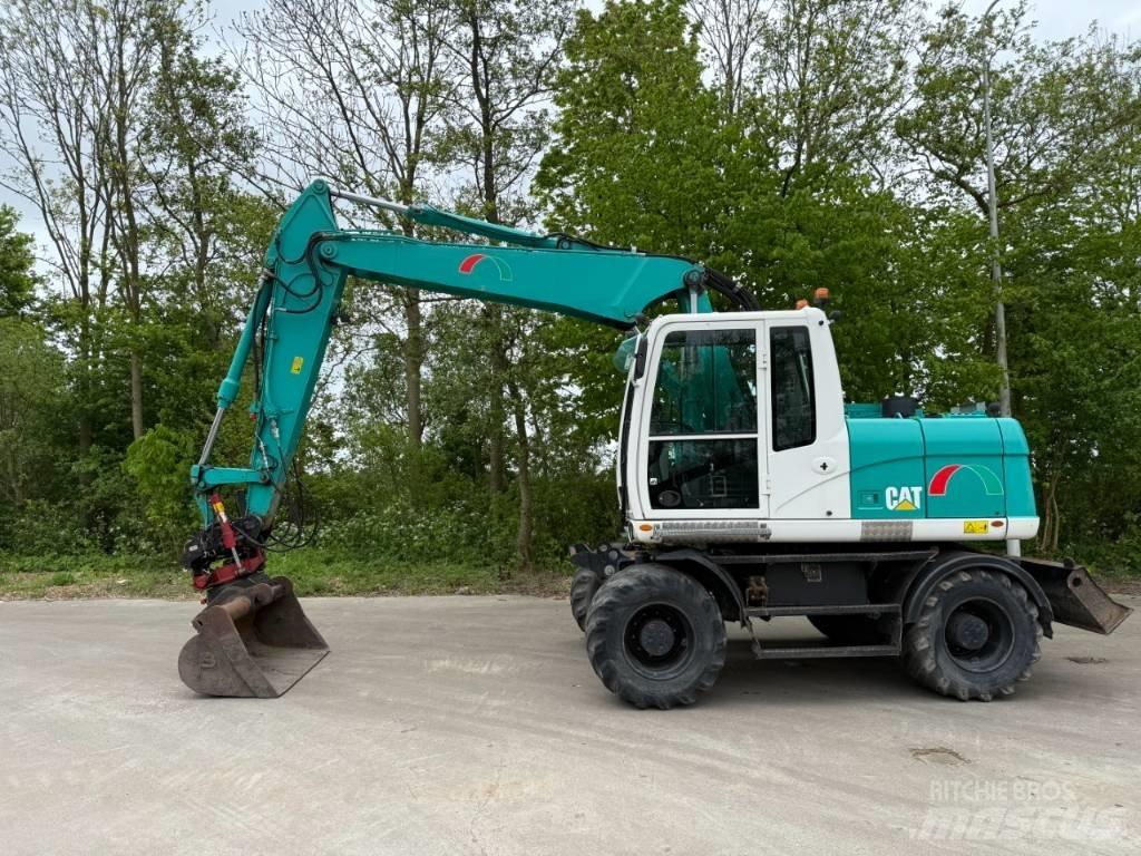 CAT M 313 D Pelle sur pneus