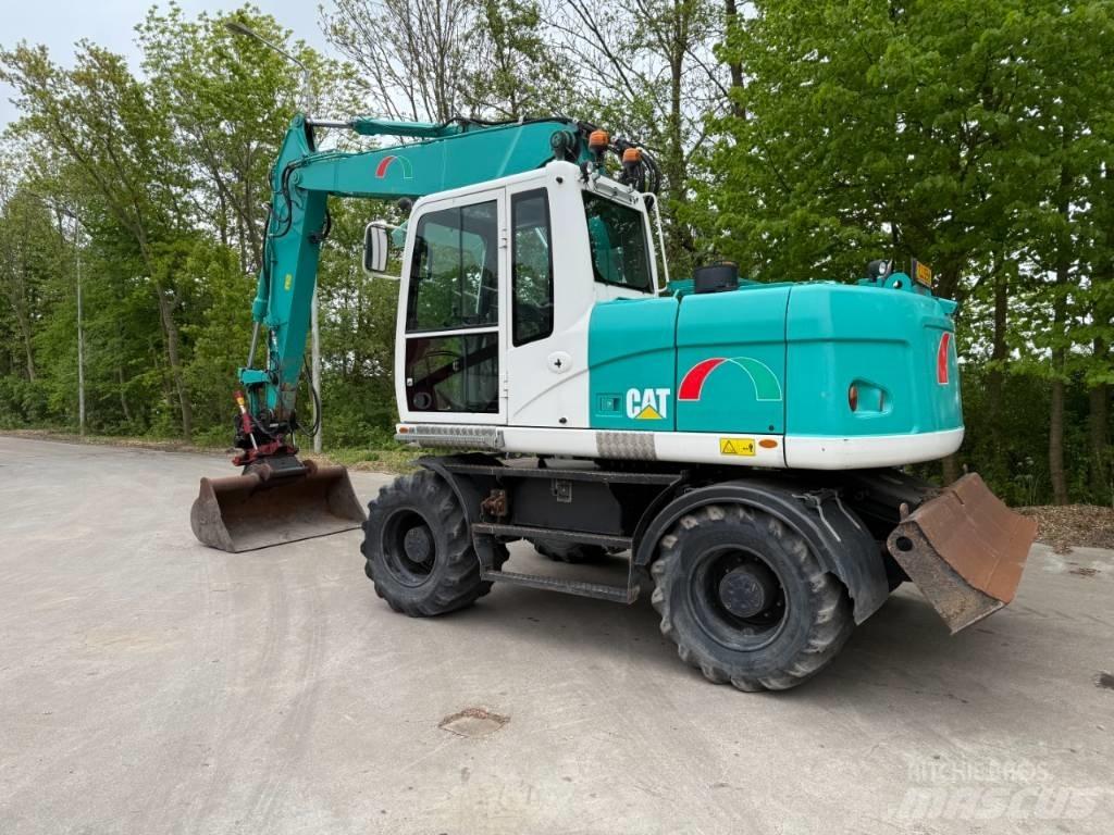CAT M 313 D Pelle sur pneus