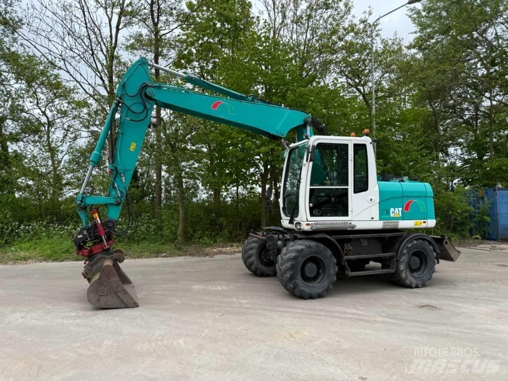 CAT M 313 D Pelle sur pneus