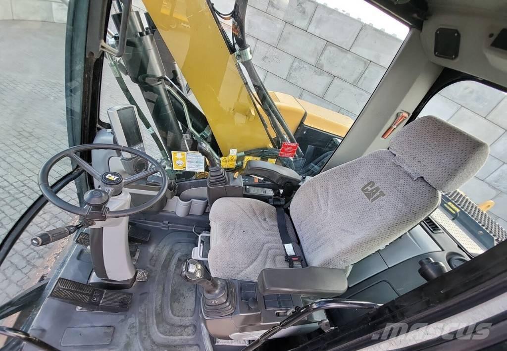 CAT M313 D Pelle sur pneus