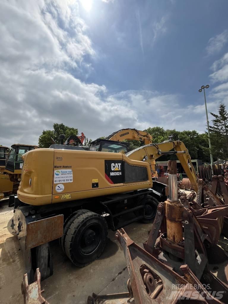 CAT MH 3024 Pelle sur pneus