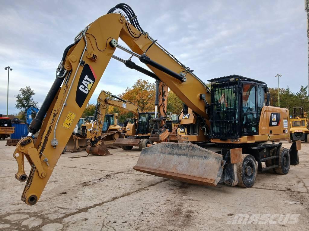 CAT MH 3024 Pelle sur pneus