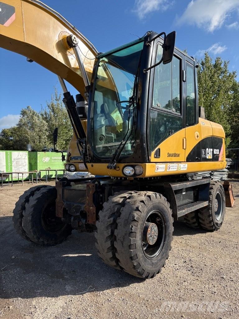 CAT M 313 D Mono Pelle sur pneus