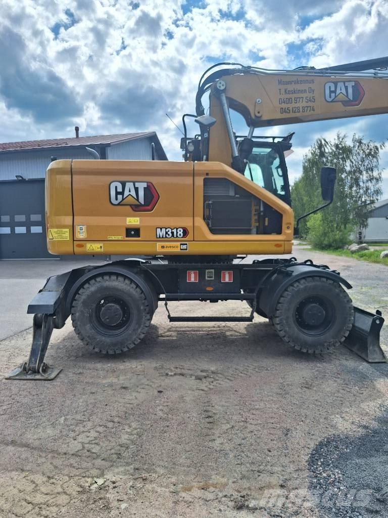 CAT M 318 Pelle sur pneus