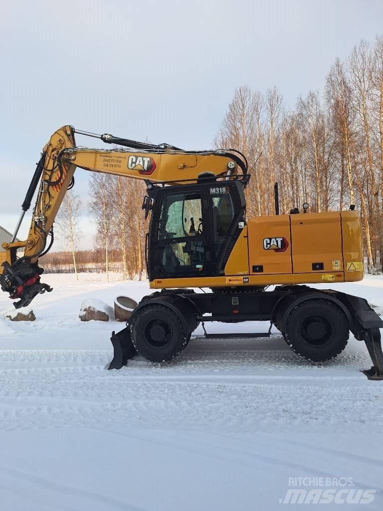 CAT M 318 Pelle sur pneus