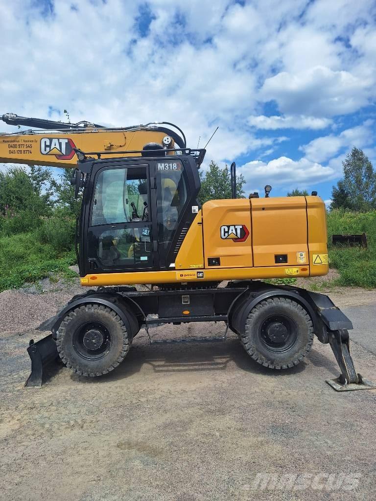 CAT M 318 Pelle sur pneus