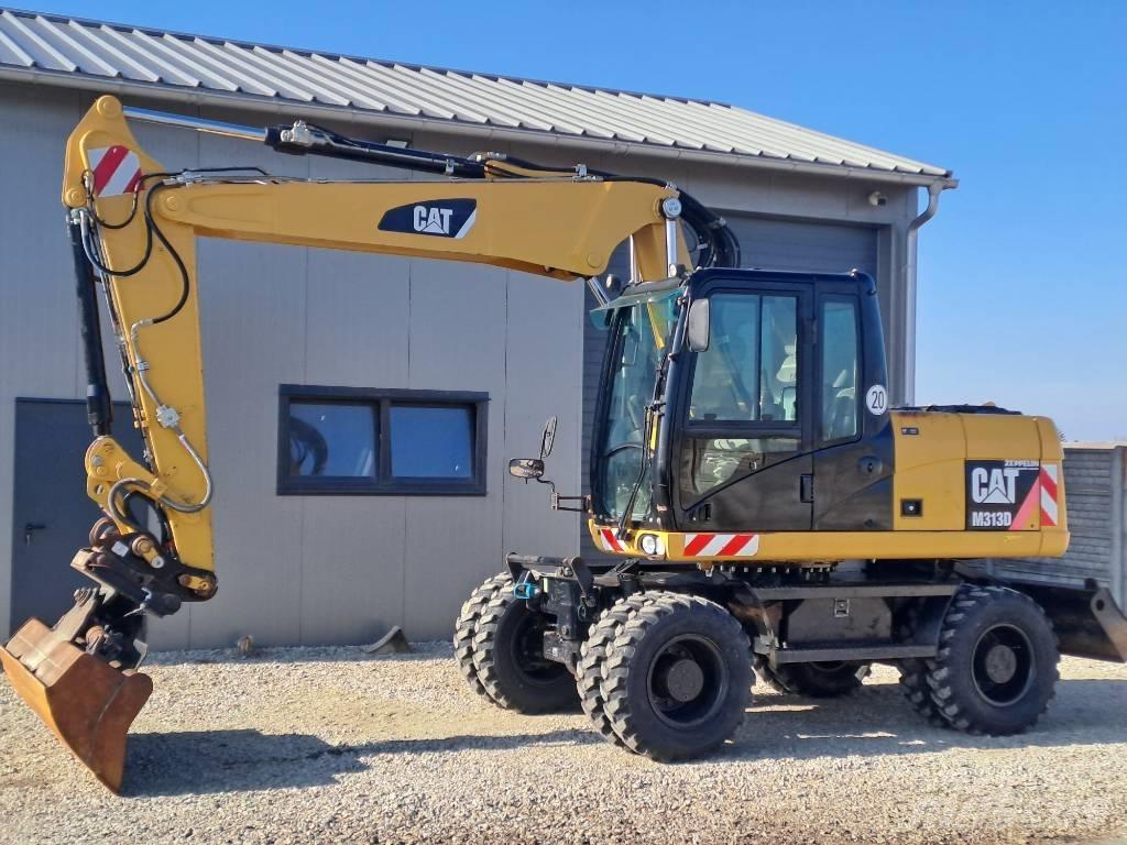 CAT M 313D Pelle sur pneus