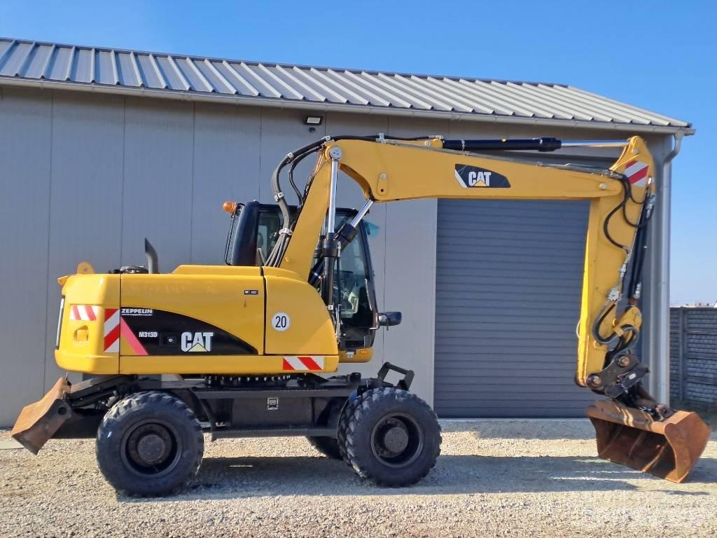 CAT M 313D Pelle sur pneus