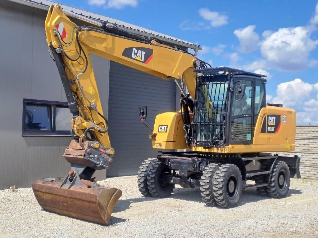 CAT M318F Pelle sur pneus