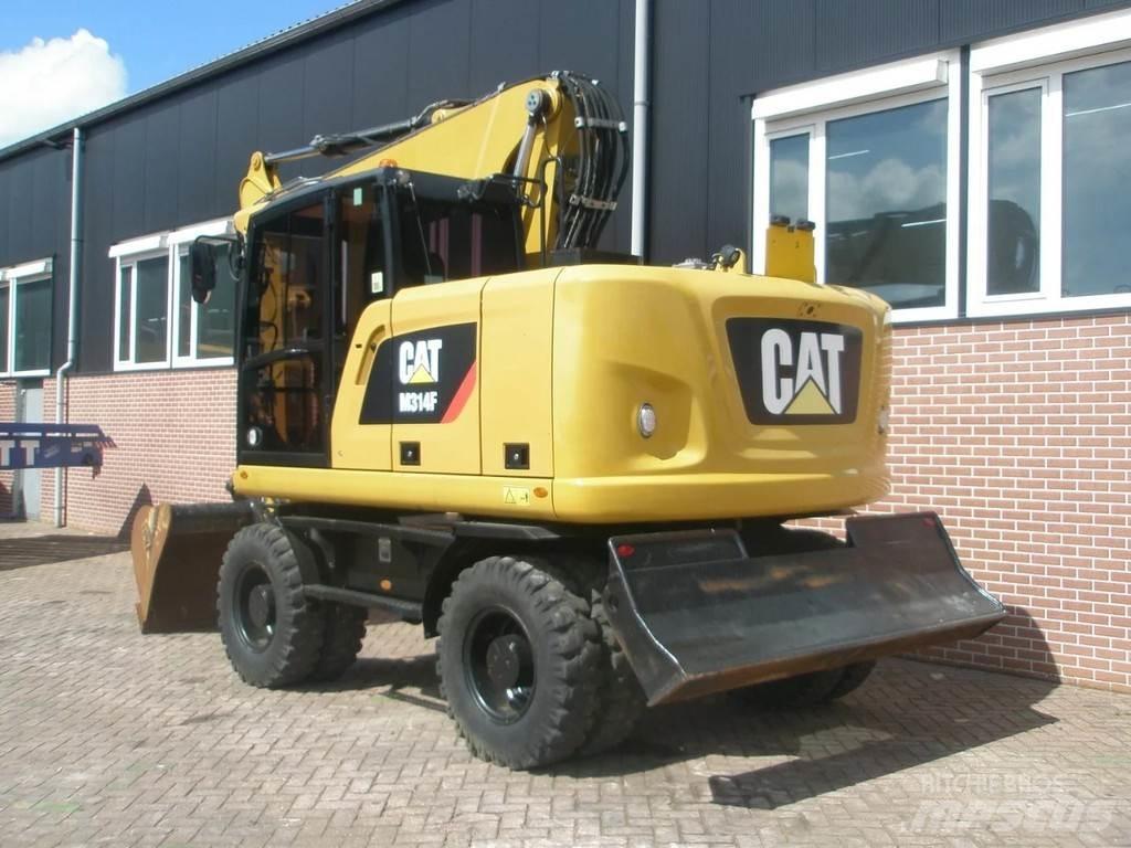 CAT M314F Pelle sur pneus