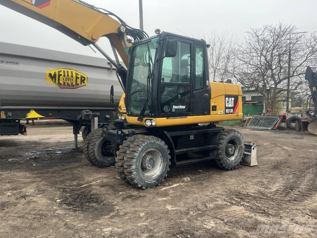 CAT 313 D Pelle sur pneus