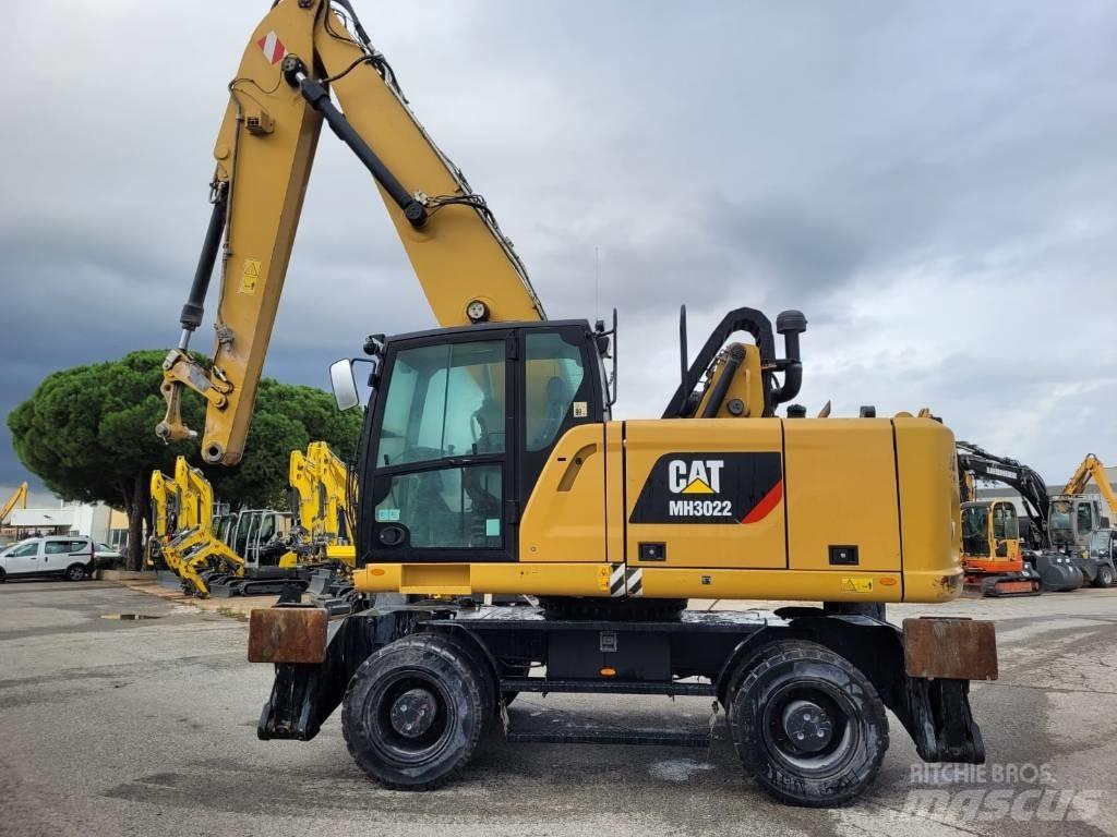 CAT mh3022 Pelle sur pneus
