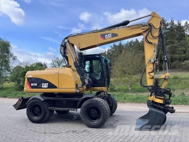 CAT M 315 D Pelle sur pneus
