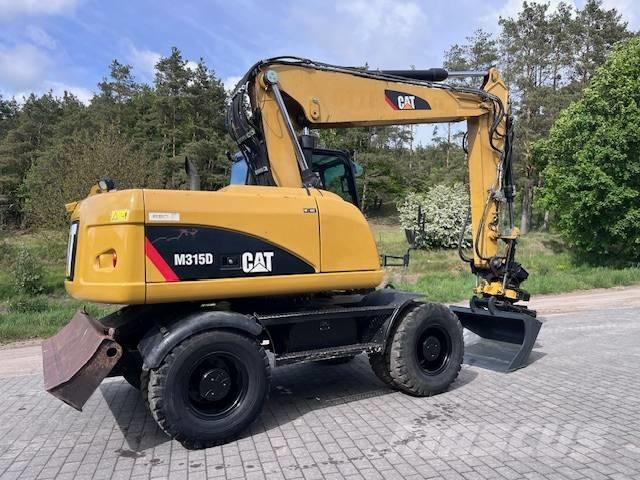 CAT M 315 D Pelle sur pneus