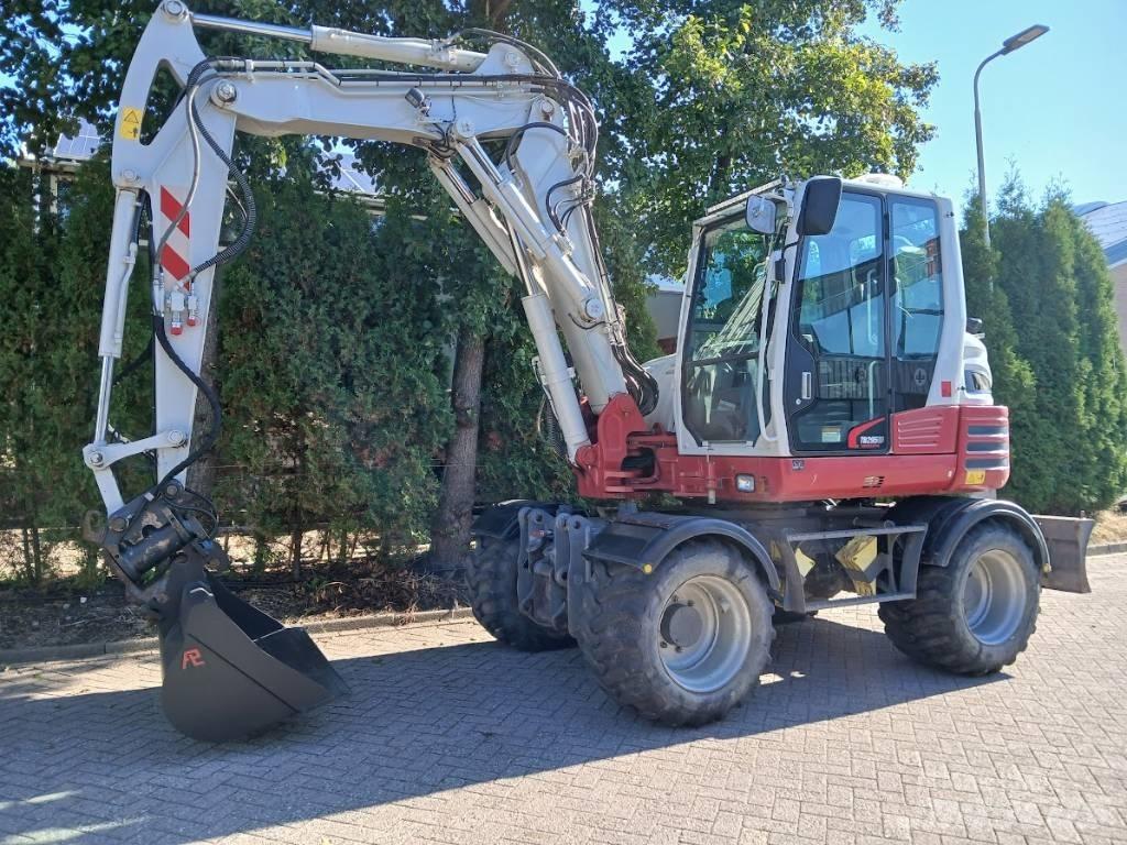Takeuchi TB 295 W Pelle sur pneus