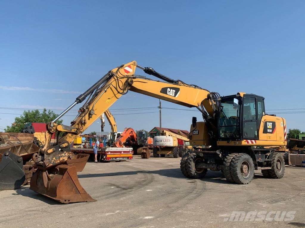CAT M 318 F Pelle sur pneus