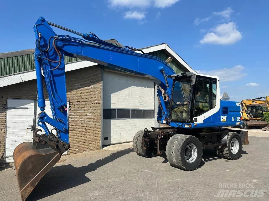 CAT M315 Pelle sur pneus